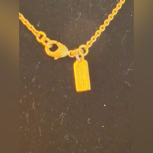 Coach gold tone necklace. Dangly gem with gold around with coach tag. - Picture 6 of 6